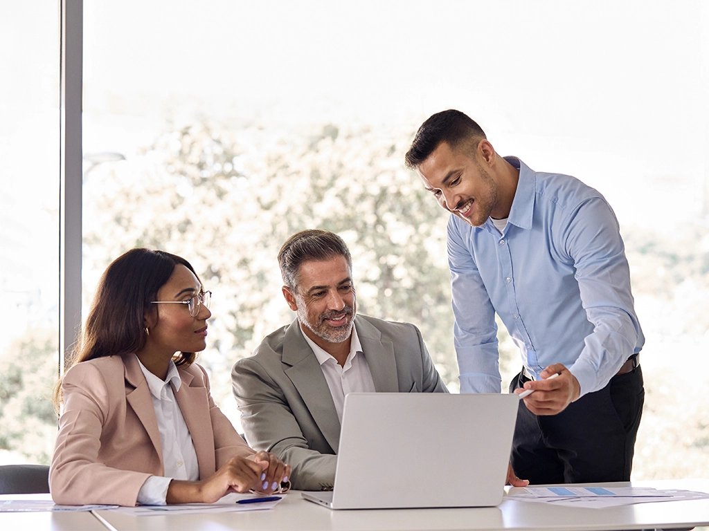 CPA advisors reviewing financial documents with a client during a consultation